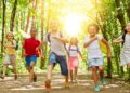 Children enjoying outdoor school holiday activities at Dubai camp with sports and adventure programs, representing engaging winter break options for families during December 2025 extended holidays
