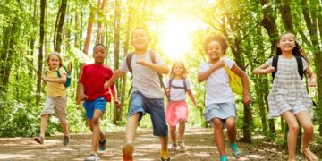 Children enjoying outdoor school holiday activities at Dubai camp with sports and adventure programs, representing engaging winter break options for families during December 2025 extended holidays
