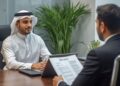 UAE labor market 2026 showing expat professionals in Dubai office discussing hiring trends and career opportunities