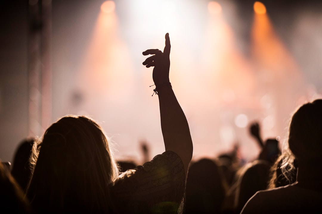 A lively crowd enjoying an indoor concert as part of Dubai Summer Surprises entertainment programme at a Dubai venue.