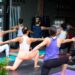 A group of women in an indoor yoga studio class in Dubai, a popular way to stay active when outdoor exercise is not possible