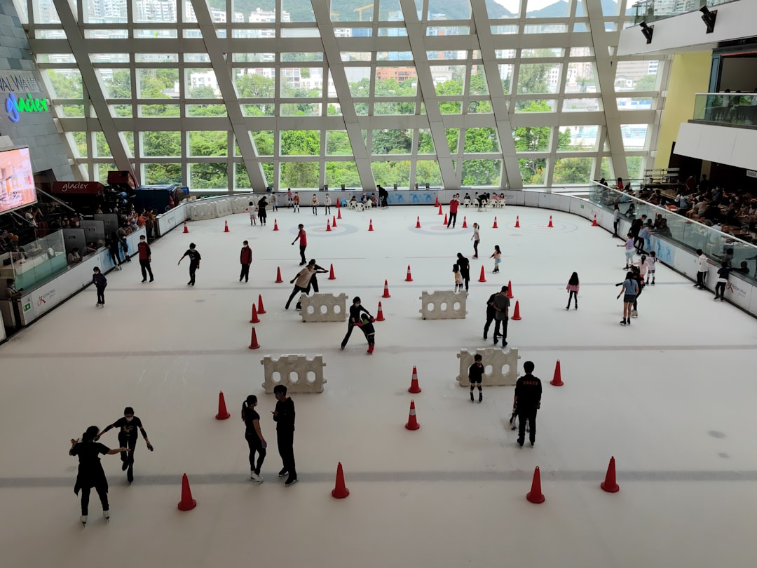 Children laugh and play in real snow at an indoor ski slope, a favourite kids attraction for Dubai families.