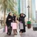 ladies_shopping_in_Dubai - DUBAIwebzine ladies exploring deals inside a Dubai mall during Dubai Summer Surprises, surrounded by colourful festival promotions.