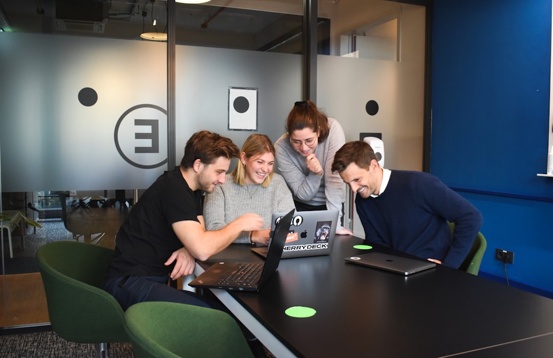 A team of investors analyzes free zone registration documents ahead of their Dubai startup launch