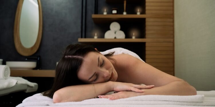 A woman resting during a luxurious indoor wellness retreat spa session in Dubai