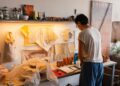 artist-studio-workspace-unsplash - DUBAIwebzine A painter works in a sunlit studio space during one of the art residencies available to Dubai residents this summer