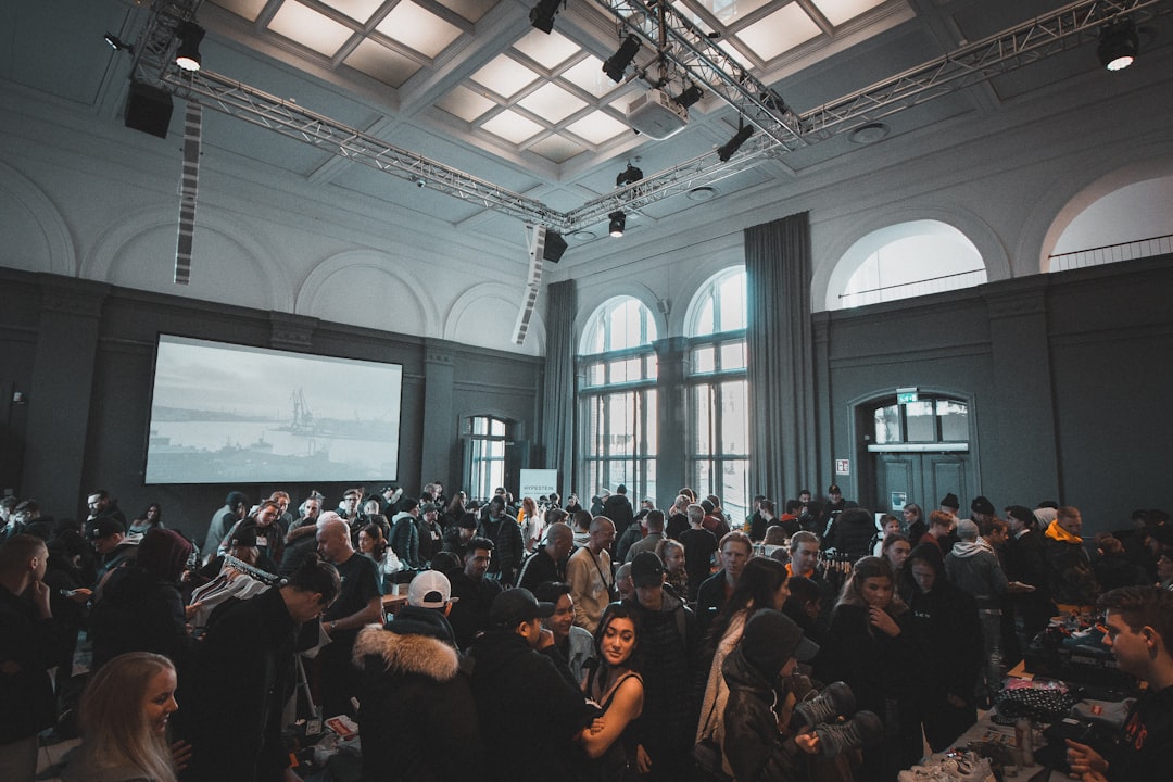 A startup founder connects with investors at a low season networking event in Dubai, building credibility before peak season