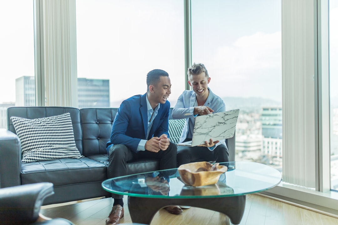 A professional reviewing off-plan property data and market reports in a Dubai high-rise office