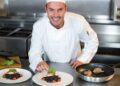 chef_presents_a_certified_gluten-free_dining - DUBAIwebzine A professional chef presents a certified gluten-free dining dish at a fine restaurant in Dubai
