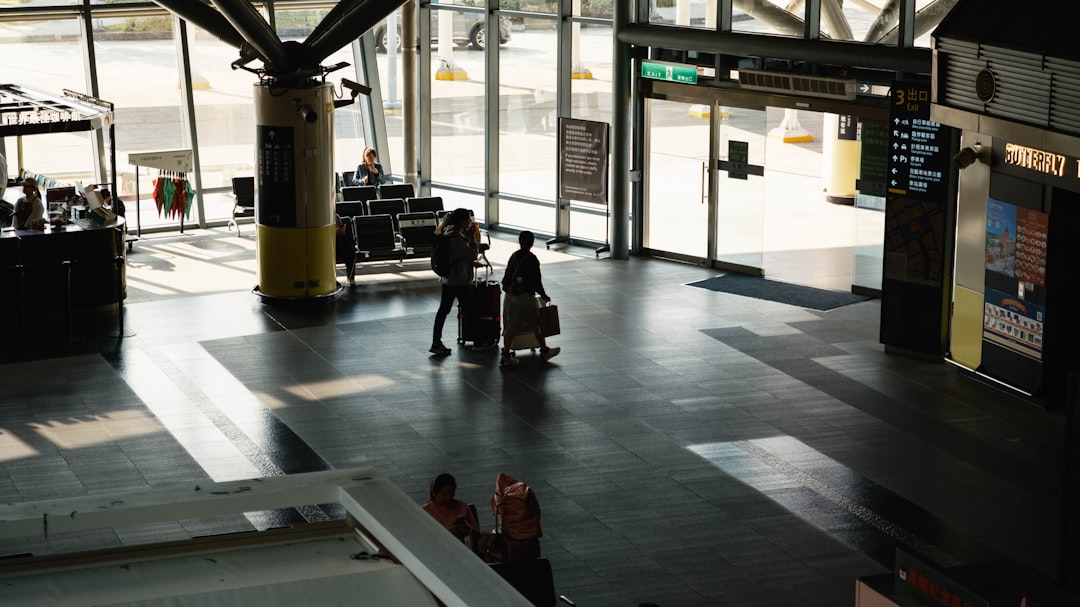 A couple boarding a long-haul flight from Dubai after booking summer fares at their lowest point