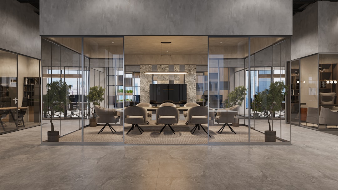 A startup team collaborates in a modern DIFC Dubai co-working space, to discuss fintech growth strategies.