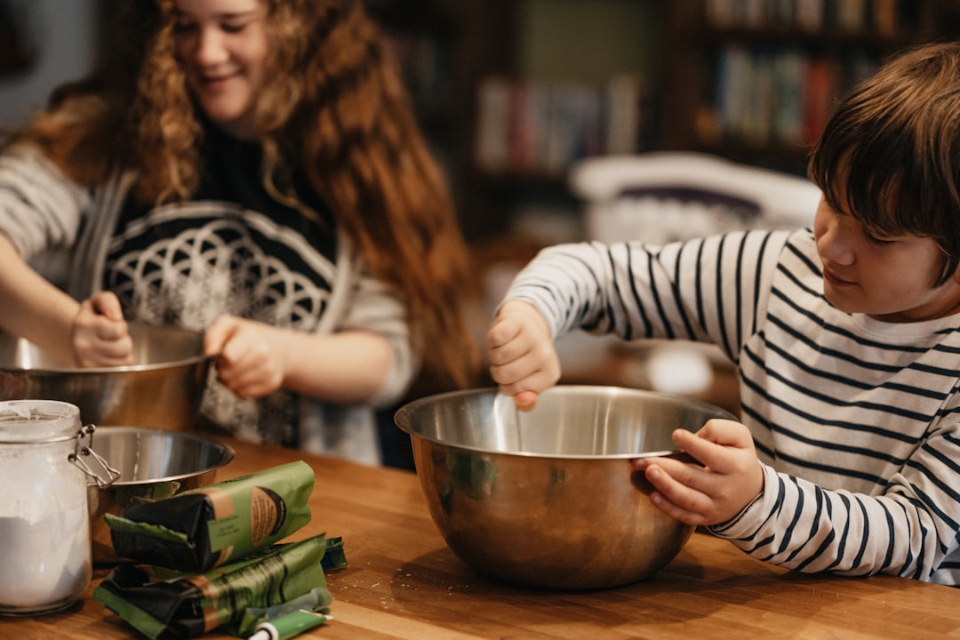 A group of children working together in a cooking class, one of the most popular creative workshops available to kids.