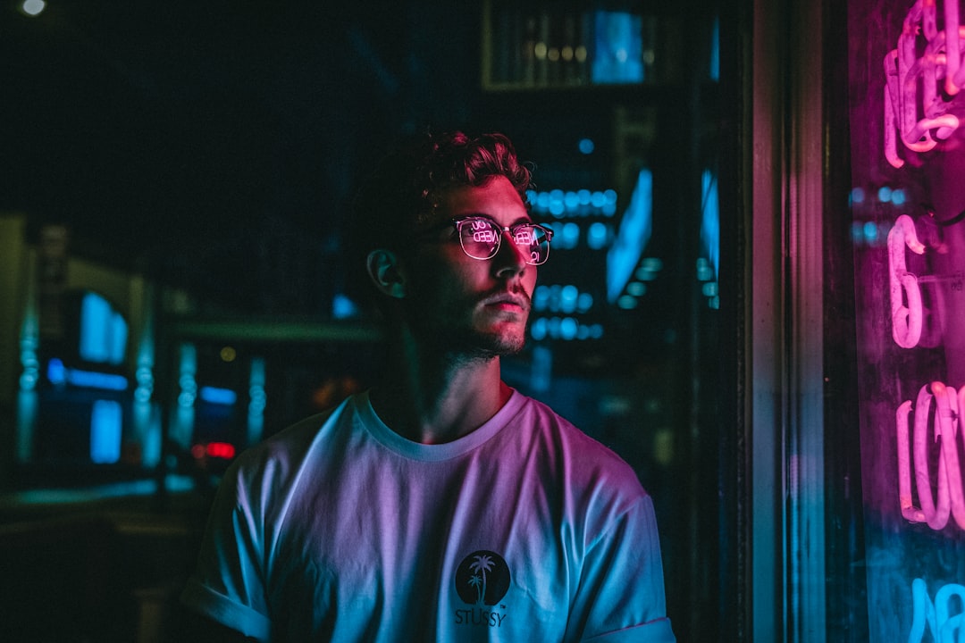 A man photographs a vibrant themed installation room at House of Hype, one of Dubai's most popular immersive art attractions