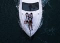 friends enjoying a private yacht charter in Dubai with the city skyline visible across the water