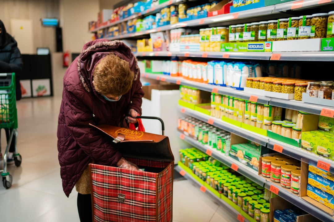 A shopper using a refill station at a Dubai supermarket as part of a zero waste grocery routine