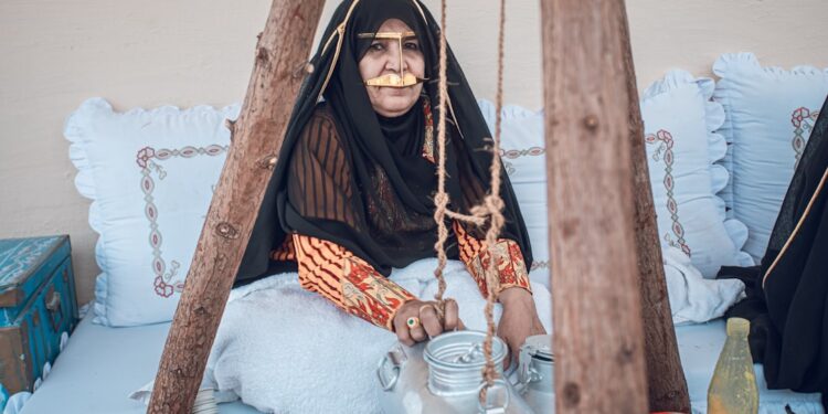 woman-arabic-traditional-coffee-unsplash - DUBAIwebzine A woman enjoys a cup of gahwa in a traditional courtyard, a central ritual of Arabic culture in Dubai