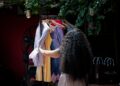 A woman wearing a breathable linen outfit that forms the core of a capsule wardrobe for Dubai summer heat