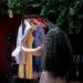 woman-choosing-linen-outfit-from-wardrobe-unsplash - DUBAIwebzine A woman wearing a breathable linen outfit that forms the core of a capsule wardrobe for Dubai summer heat