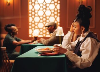 A woman enjoying a curated set menu during summer restaurant week at a Dubai restaurant
