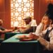 woman-in-restaurant-unsplash - DUBAIwebzine A woman enjoying a curated set menu during summer restaurant week at a Dubai restaurant