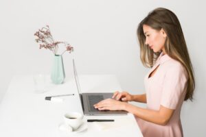A female entrepreneur builds her personal brand strategy during Dubai's low season at a modern co-working space