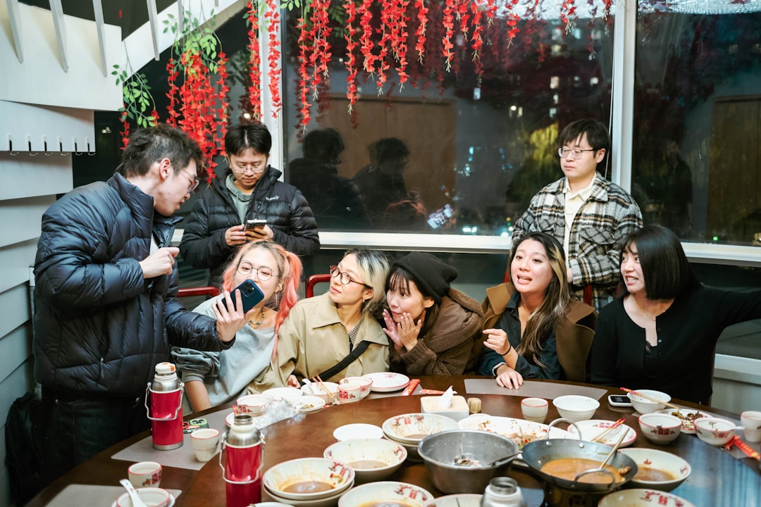 Friends share contemporary dishes at a Dubai restaurant, celebrating the arrival of fresh autumn menus for the new season