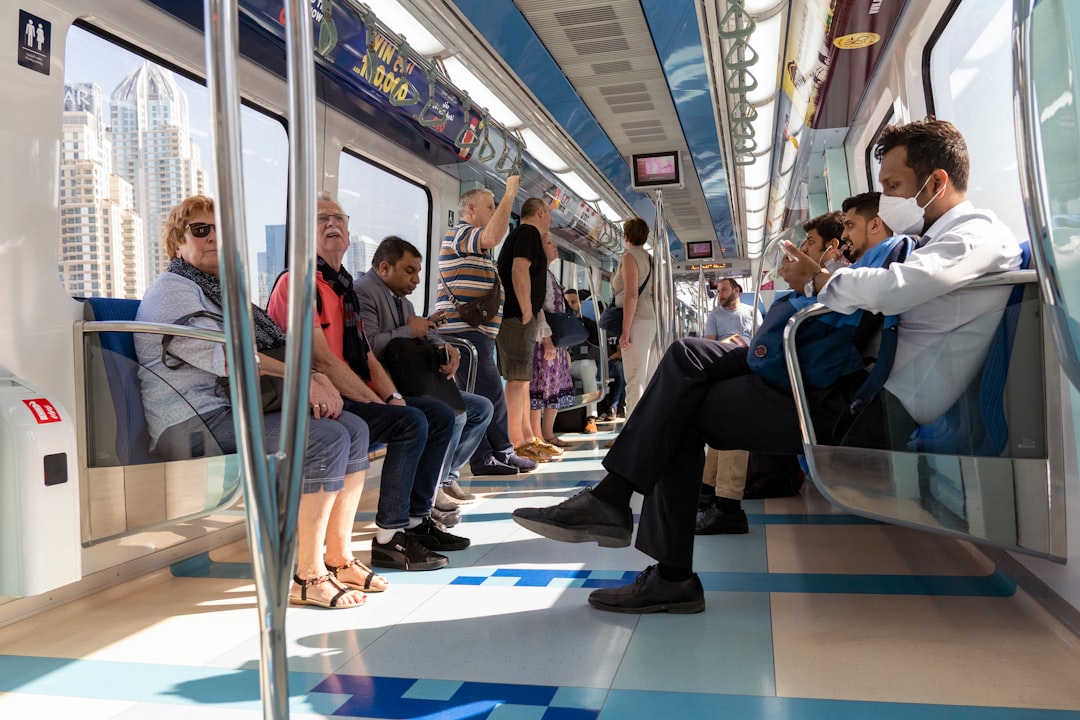ride in the Dubai Metro toward the city center during a Dubai transit layover, with the skyline visible through the window.