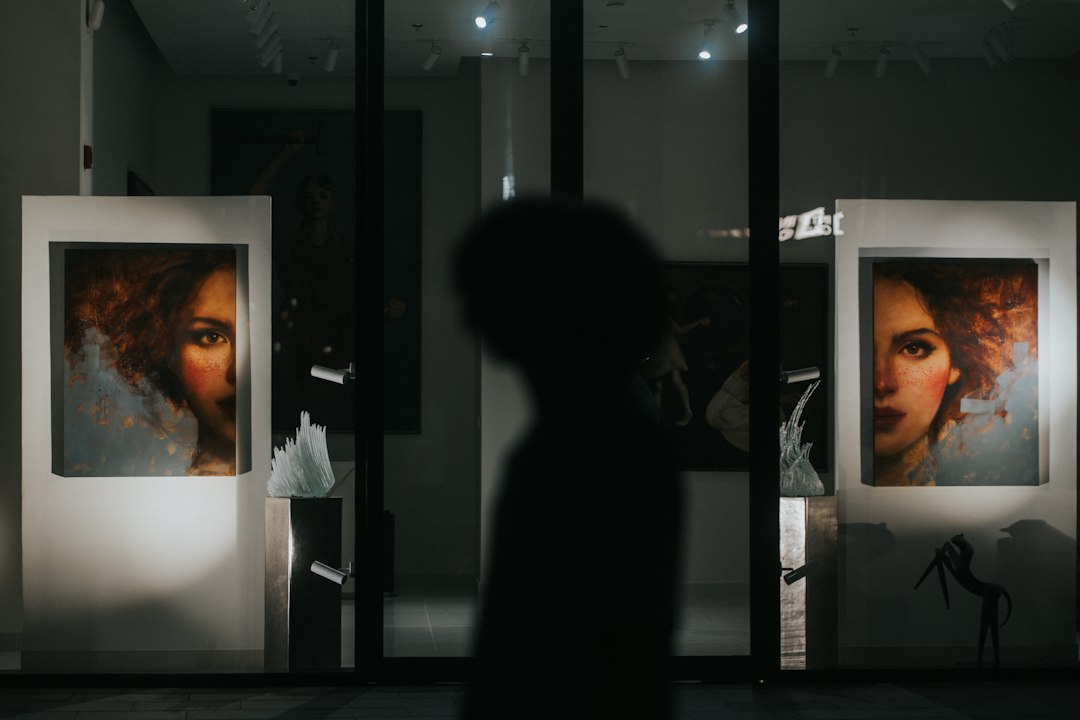 Two visitors browse contemporary paintings inside an Al Quoz gallery as part of Dubai's cultural scene in September