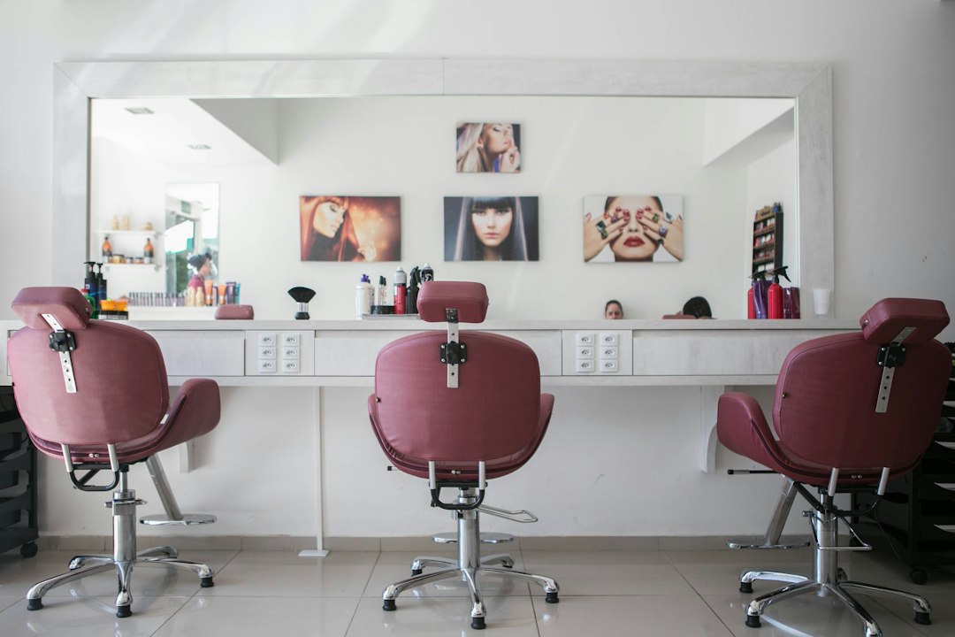 Customer checking her finish after visiting Dubai blow-dry bars this autumn