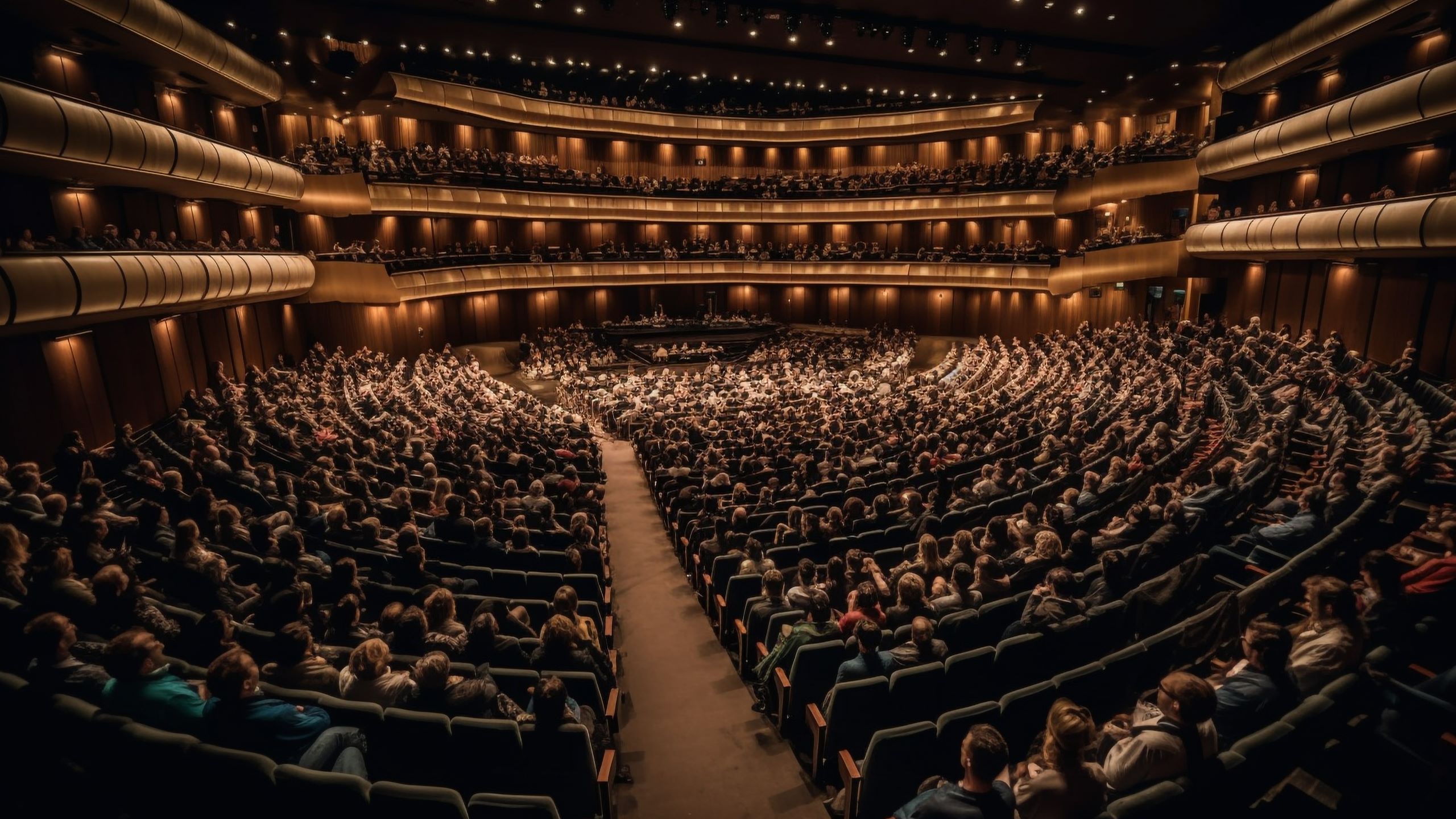 Spettacolo alla Dubai Opera con un'elegante illuminazione scenica e pubblico; la stagione operistica offre spettacoli culturali e artistici
